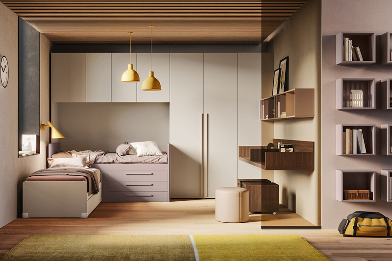 Cameretta angolare beige e rosa con letto angolare con box e cassettoni