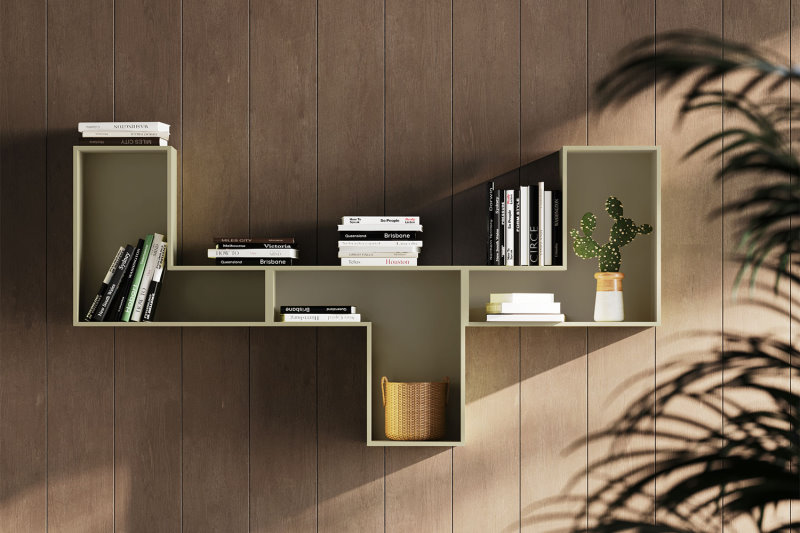 Composizione asimmetrica di mensole contenitore verdi da parete